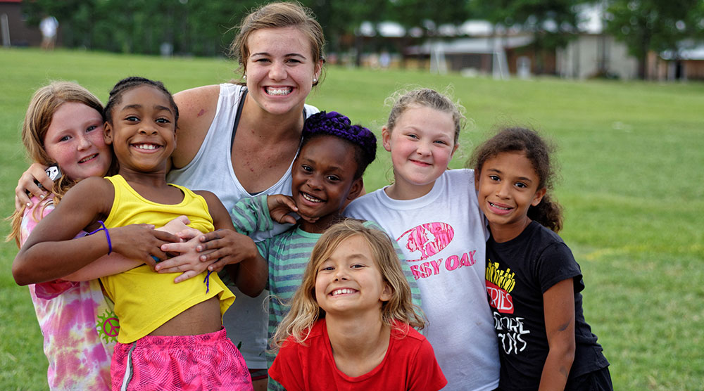 Camp Grace counselor with campers