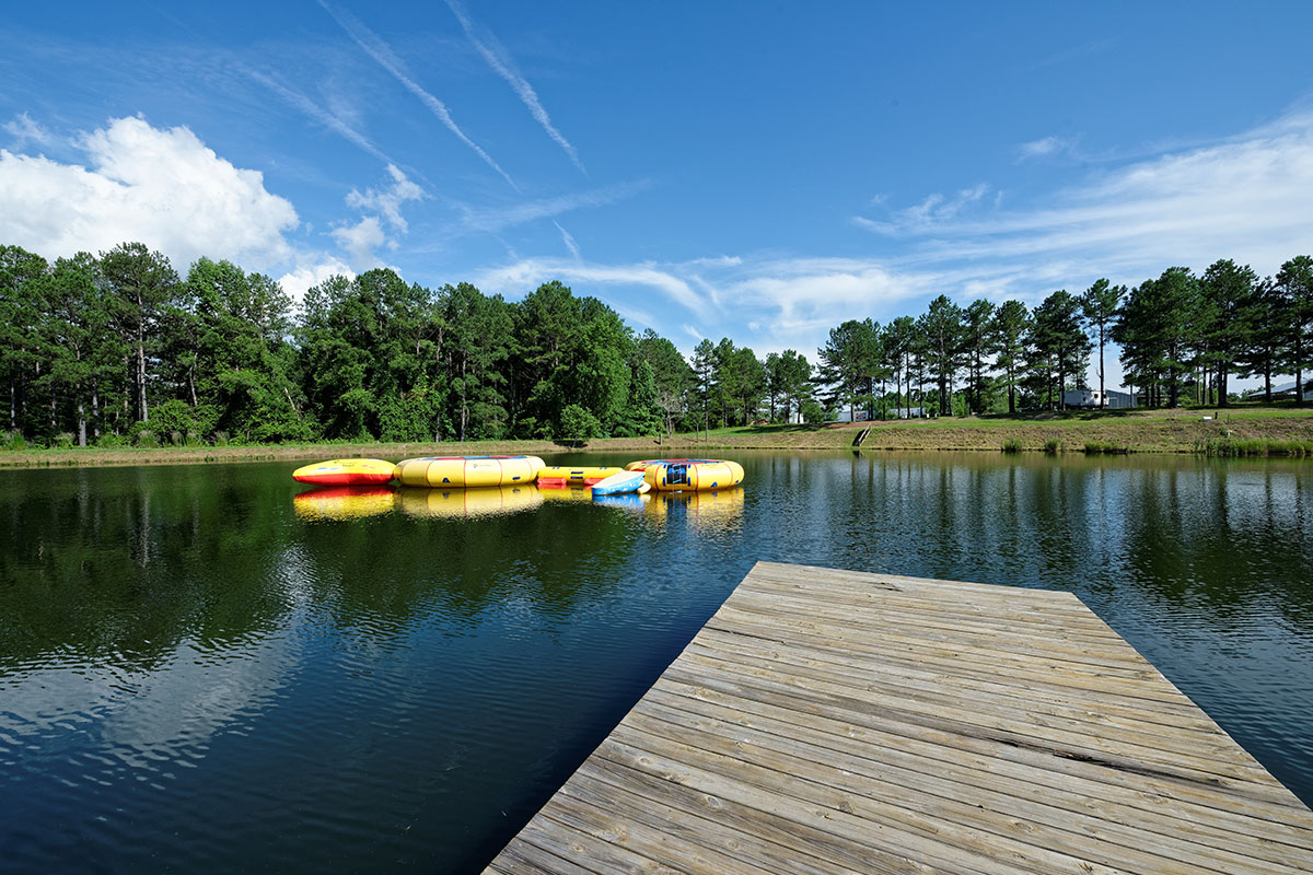 Camp Grace lake with dock and water activities